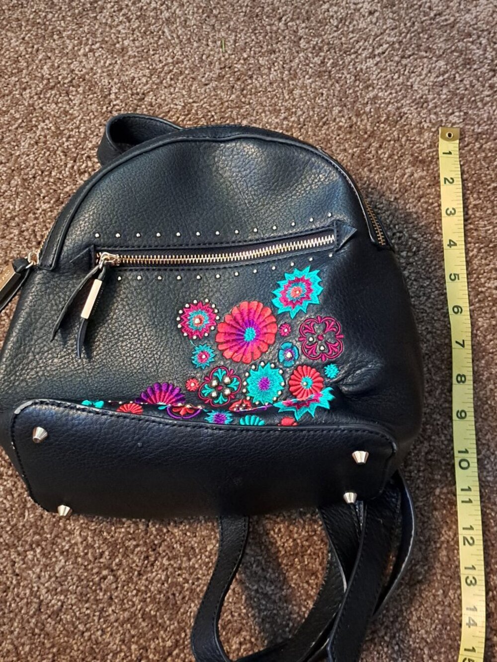 Black Steve Madden embroidered floral backpack with gold hardware. - Picture 13 of 13